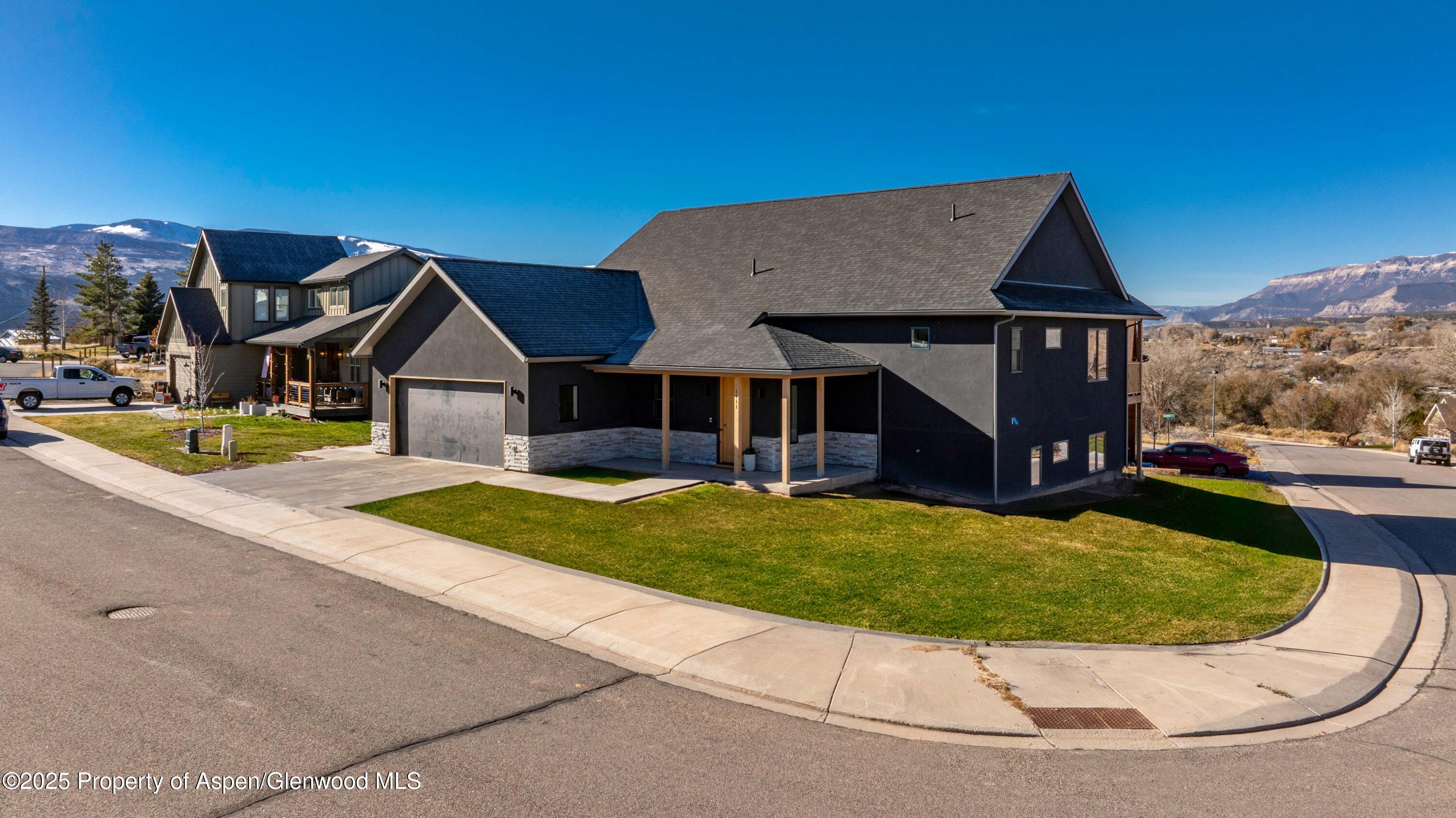 1411 Rifle Heights Drive Rifle, CO 81650 - Photo 31 of 31 a view of a house with a swimming pool