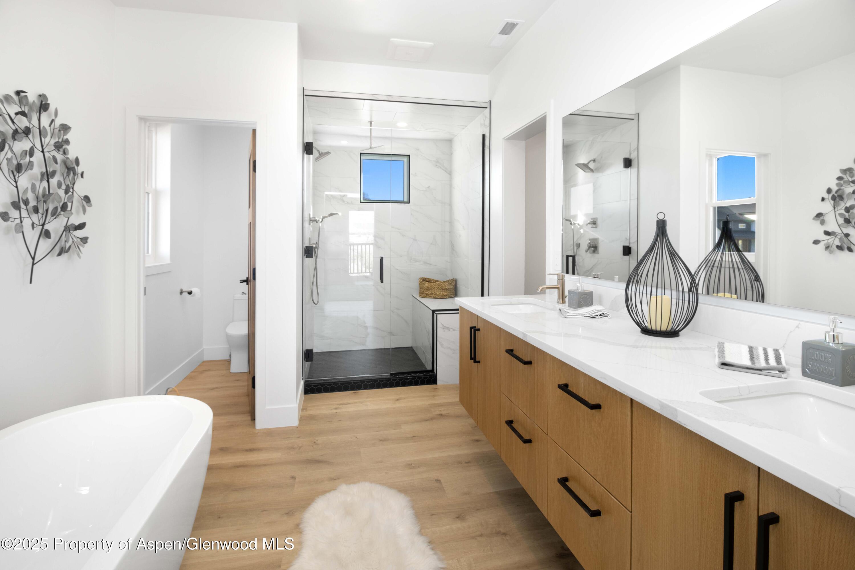 1411 Rifle Heights Drive Rifle, CO 81650 - Photo 10 of 31 a spacious bathroom with a double vanity sink mirror double and shower