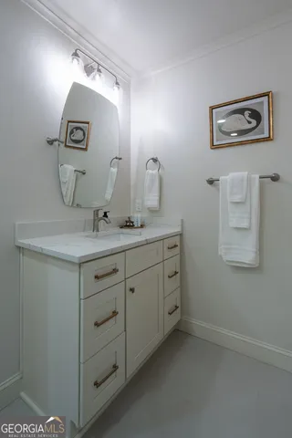 a bathroom with a sink and mirror