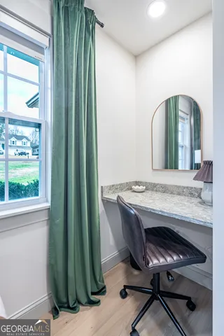 a view of a livingroom with furniture and window