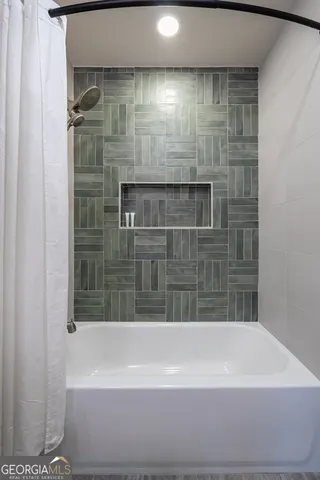 a bathroom with a bathtub