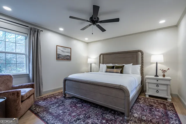 a bedroom with a bed and with furniture