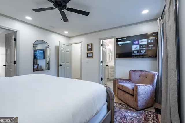 a bedroom with furniture and a window