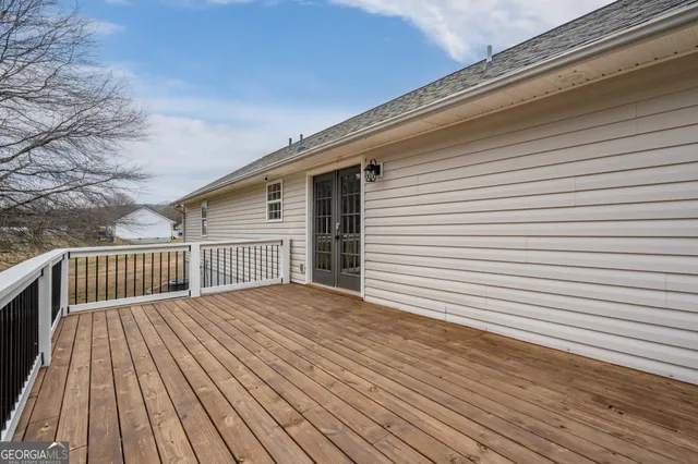 a view of backyard with a deck