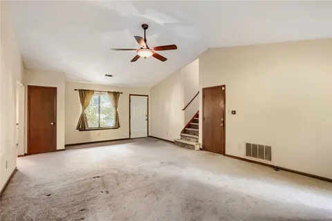 a view of a livingroom with a staircase