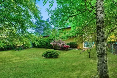 a view of backyard with green space