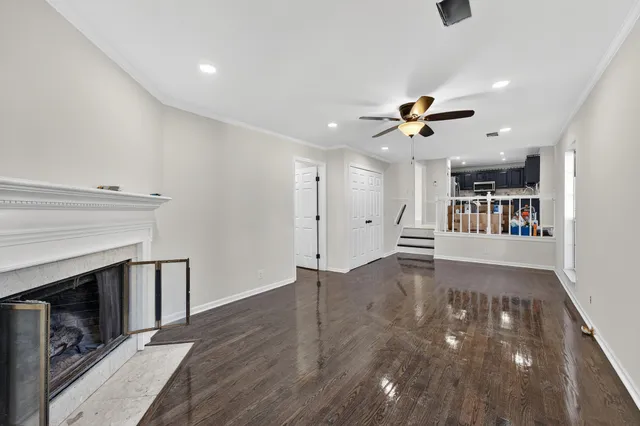 wooden floor in an empty room with a fireplace