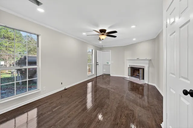 a work room with furniture and wooden floor