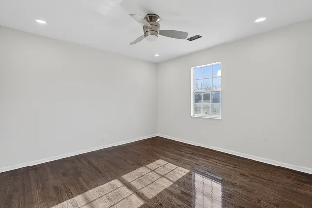 a bathroom with a window sink and vanity