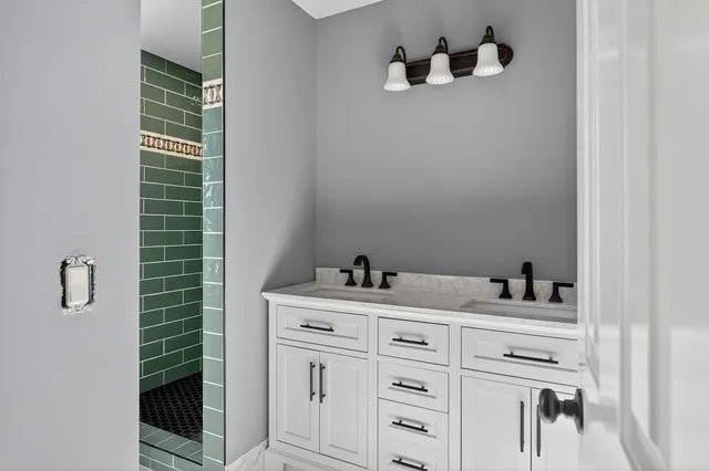 a white toilet sitting next to a bathroom sink