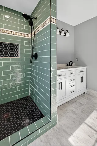 a bathroom with a sink toilet and mirror