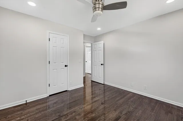a view of wooden floor and trees with wooden fence