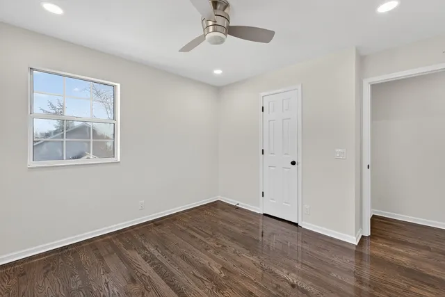 a view of a wooden deck and a backyard
