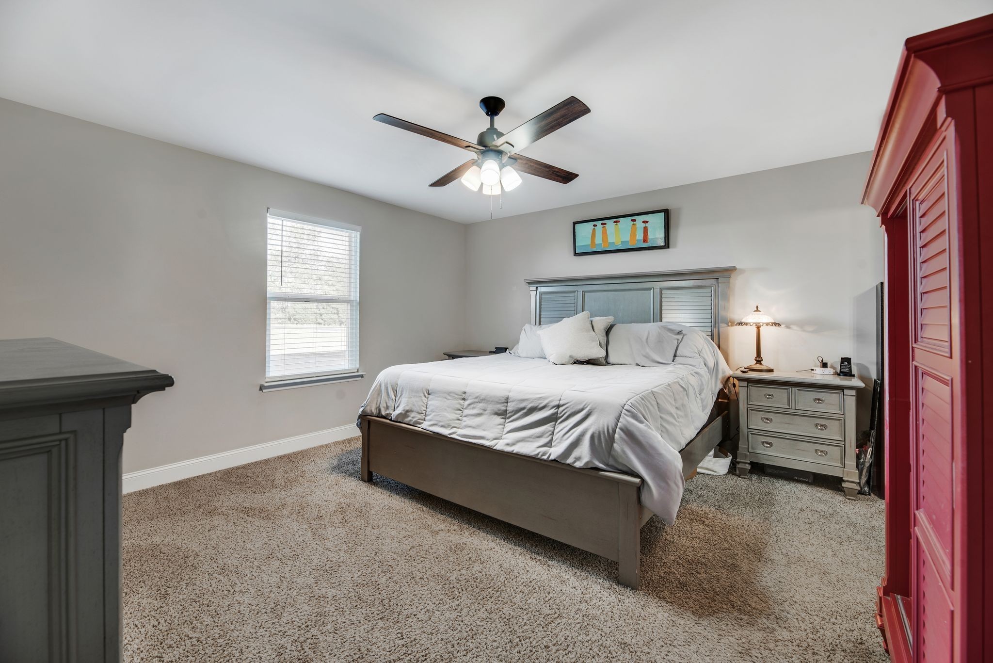 997 State Highway 99 Waynesboro, TN 38485 - Photo 19 of 33 a bedroom with a bed and a chandelier