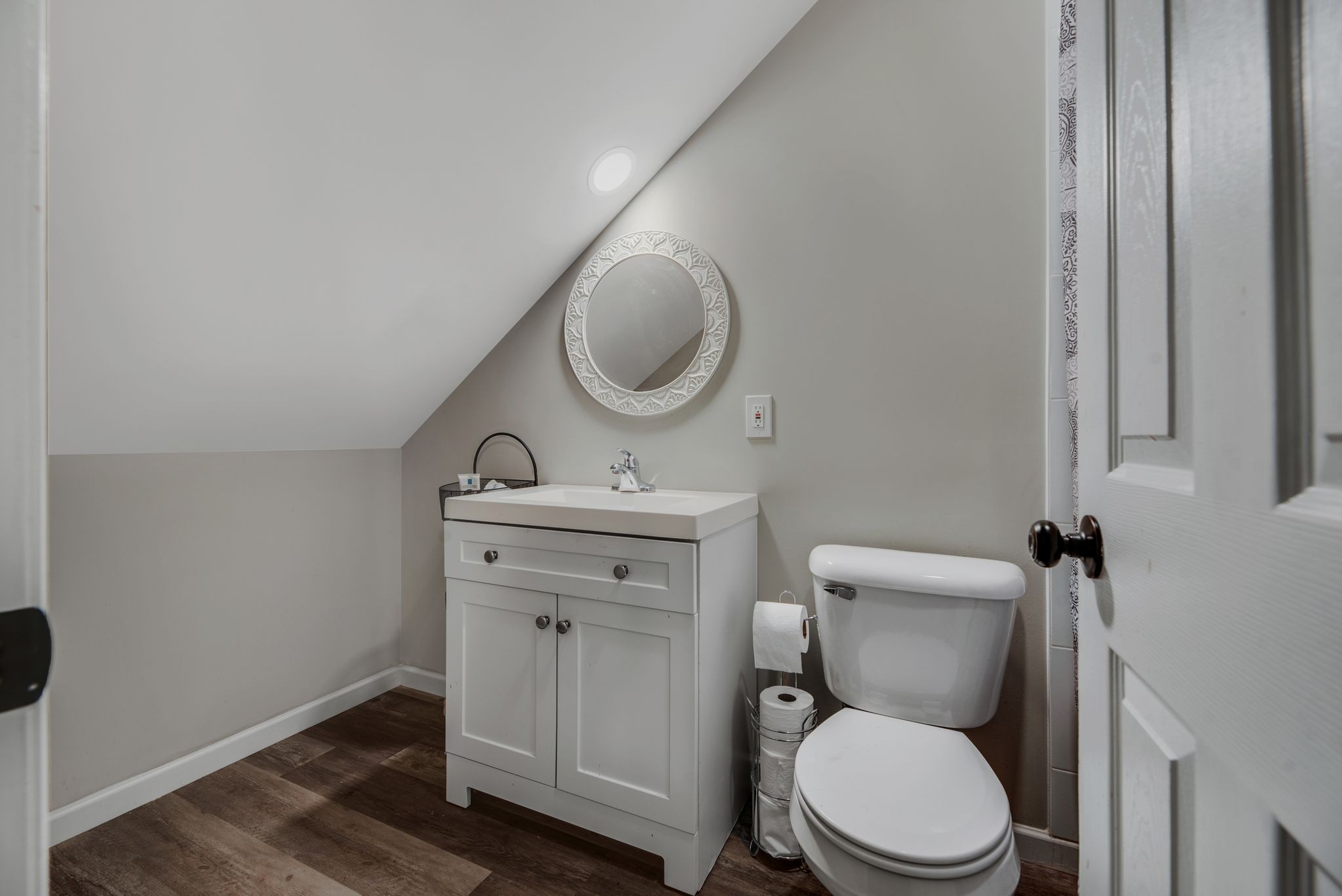 997 State Highway 99 Waynesboro, TN 38485 - Photo 33 of 33 a bathroom with a toilet a sink and mirror
