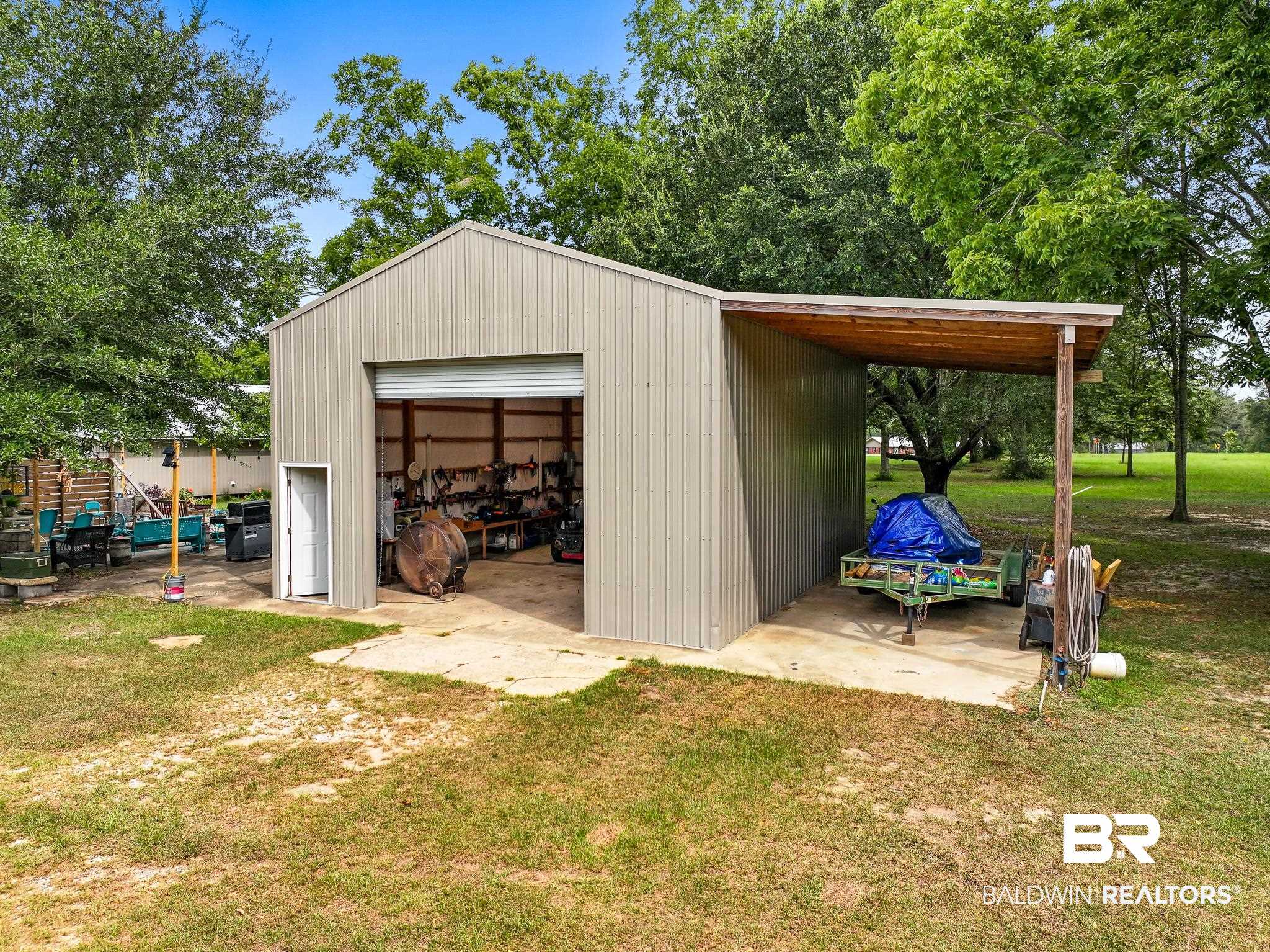 11528 Whitehouse Fork Road Bay Minette, AL 36507 - Photo 36 of 37 View of outdoor structure with a lawn, a garage, and a carport