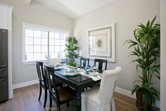 a view of a dining room with furniture window and flowerpot