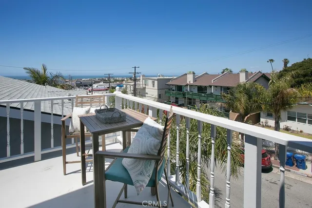 a view of a balcony with furniture