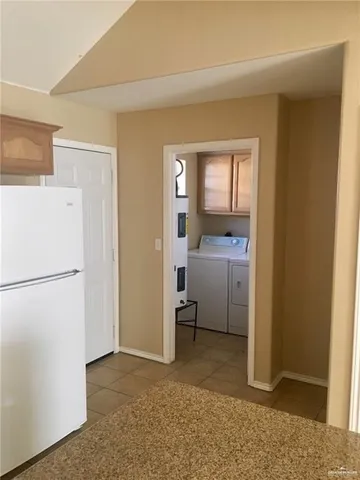 a view of a storage & utility room with closet window