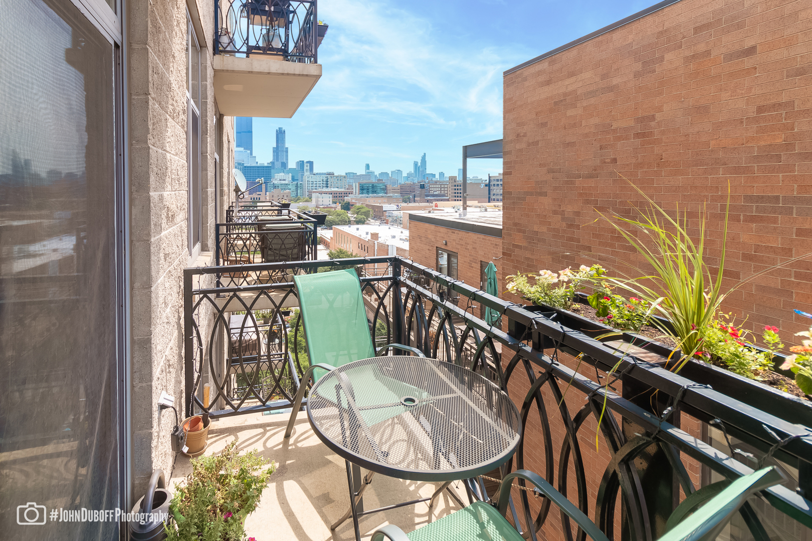 1201 West Adams Street, Unit 809 Chicago, IL 60607 - Photo 8 of 14 a balcony view with a large window and potted plants
