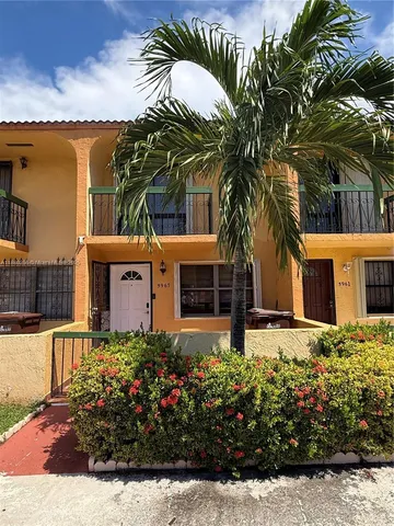 a front view of house with small garden