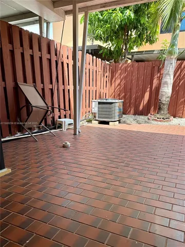 a view of a terrace with wooden fence
