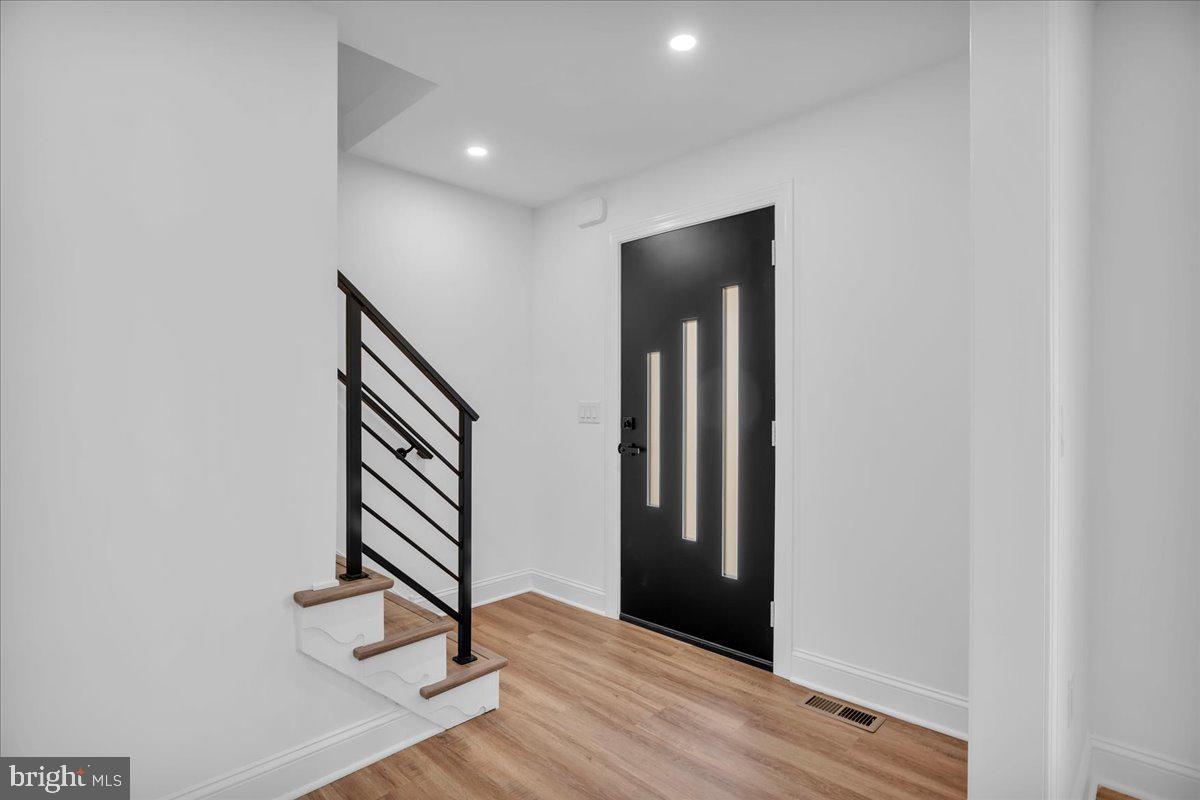2504 Church Road Cinnaminson, NJ 08077 - Photo 7 of 79 an entryway in a hall with wooden floor