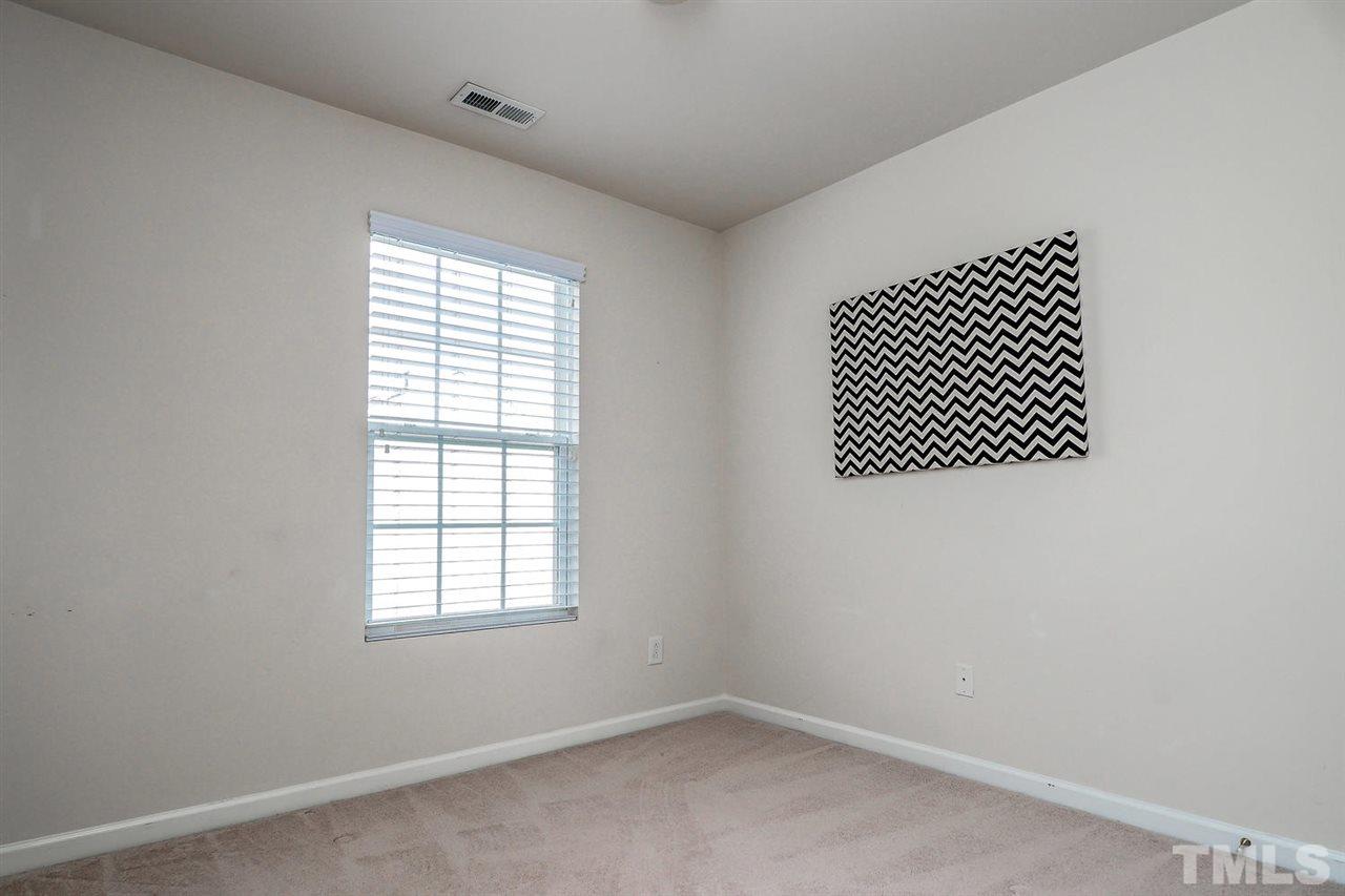 8205 Rhiannon Road Raleigh, NC 27613 - Photo 14 of 23 an empty room with a window