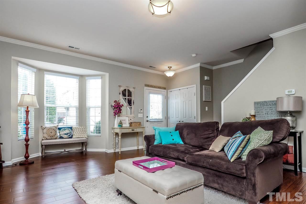 8205 Rhiannon Road Raleigh, NC 27613 - Photo 5 of 23 a living room with furniture and a large window