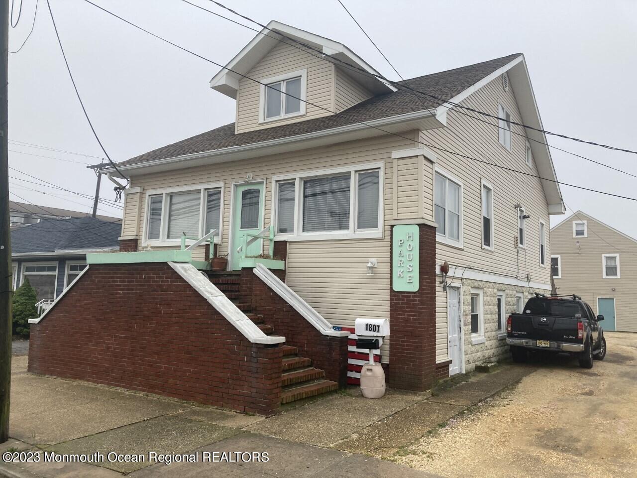 1805 Ocean Boulevard Seaside Park, NJ 08752 - Photo 2 of 6 a front view of a house with parking space
