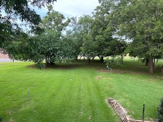 a view of a lake with a yard