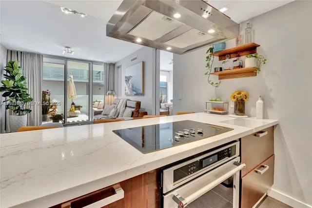 a kitchen with a sink and a large window