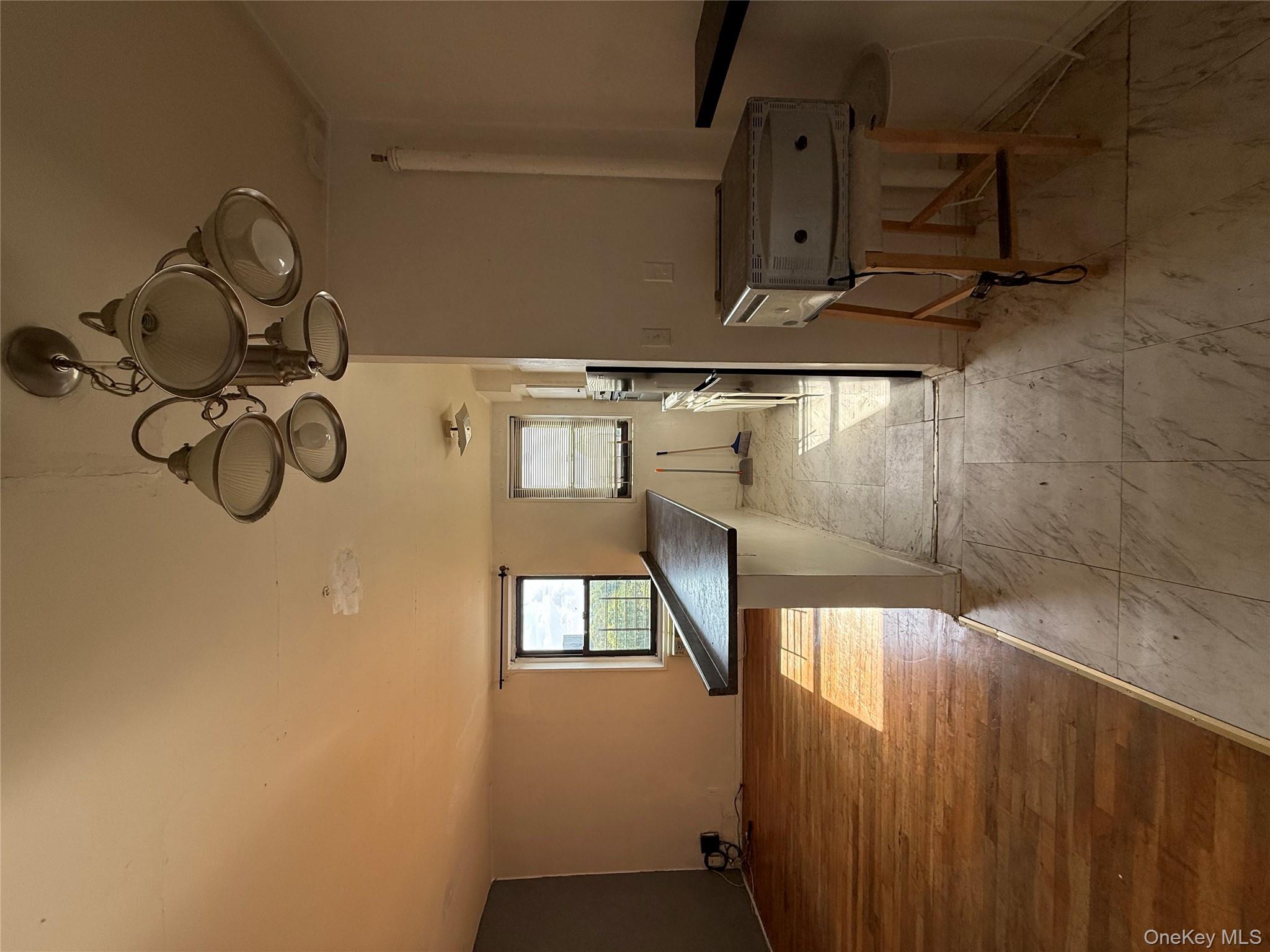 143 Bruce Avenue, Unit 7A Yonkers, NY 10705 - Photo 3 of 8 a view of a room with gym equipment