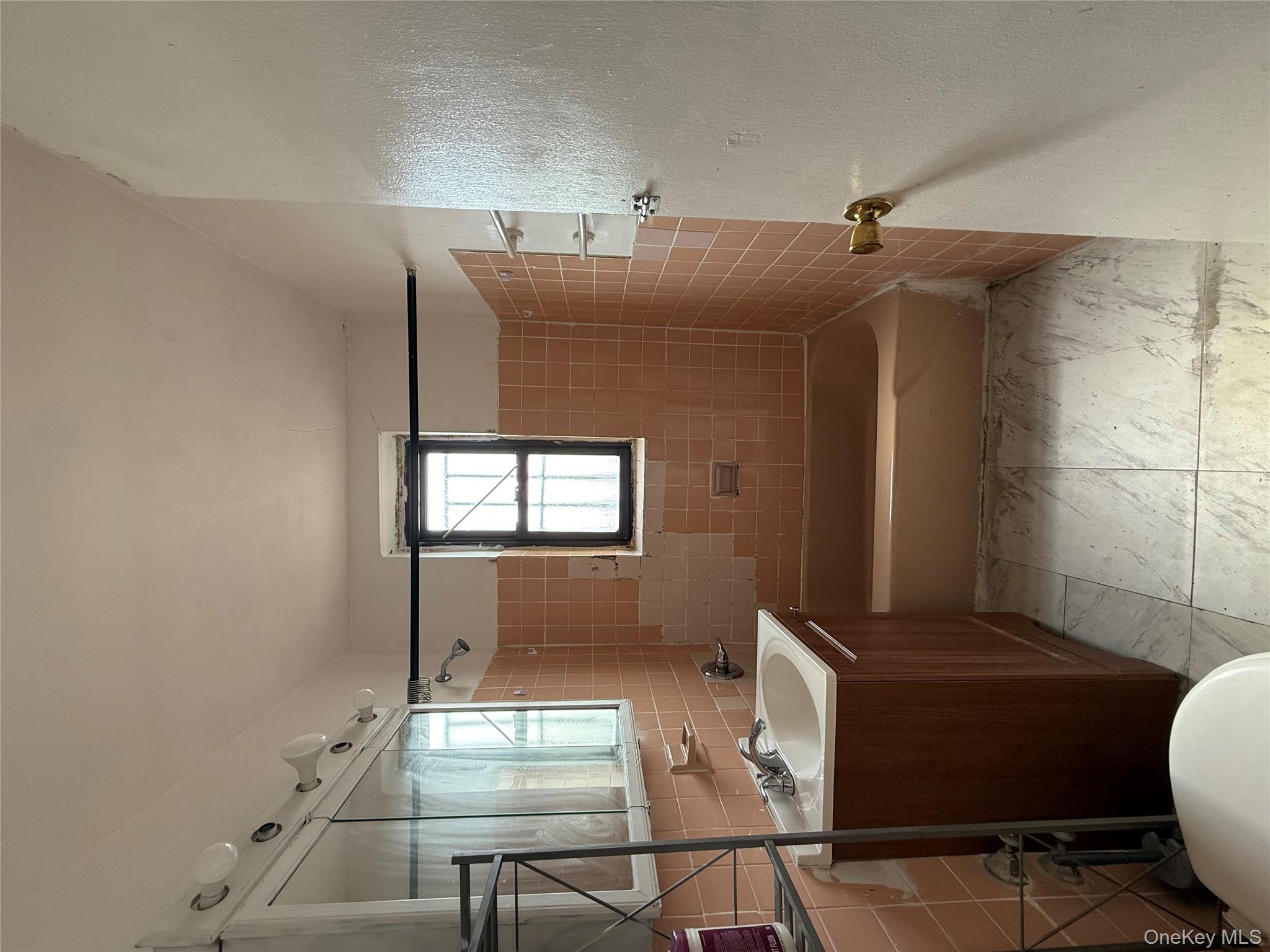143 Bruce Avenue, Unit 7A Yonkers, NY 10705 - Photo 6 of 8 a bathroom with a sink toilet vanity and tub