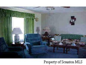 107 Miller Road Clarks Summit, PA 18411 - Photo 2 of 5 a living room with furniture and a large window