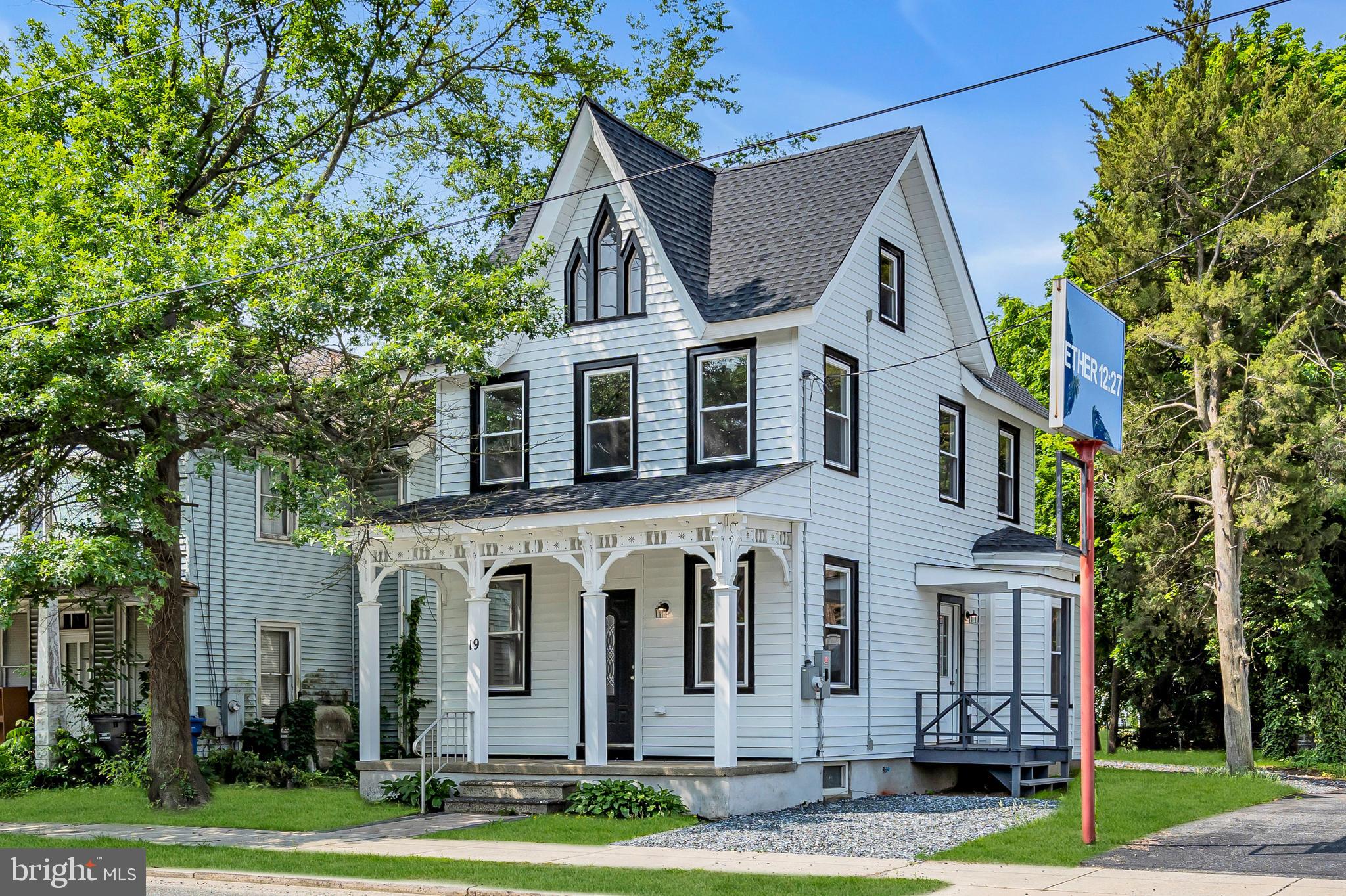 19 East Main Street Salem, NJ 08079 - Photo 1 of 28 a front view of a house with a yard and large trees