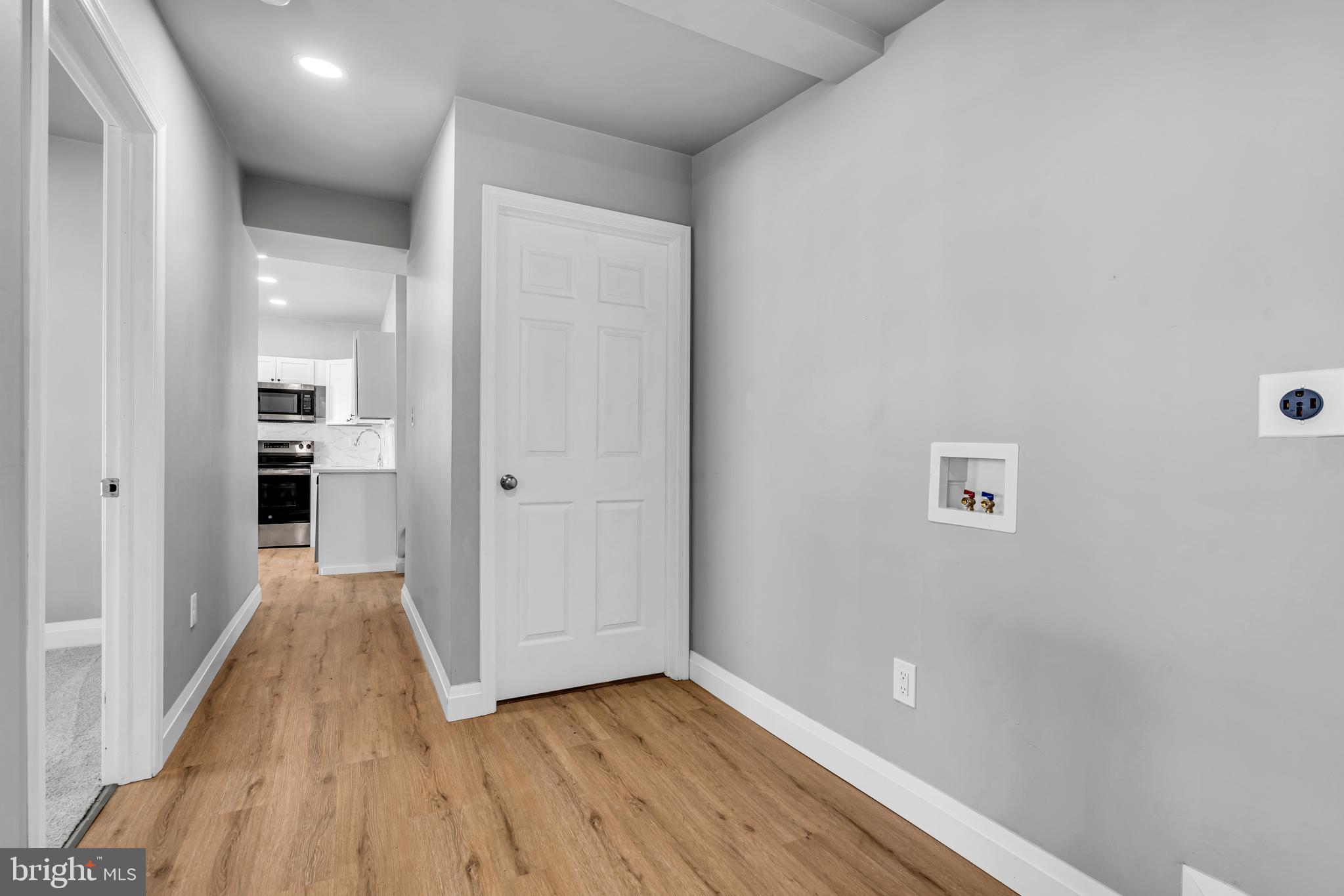 19 East Main Street Salem, NJ 08079 - Photo 14 of 28 a view of a hallway with wooden floor and a kitchen