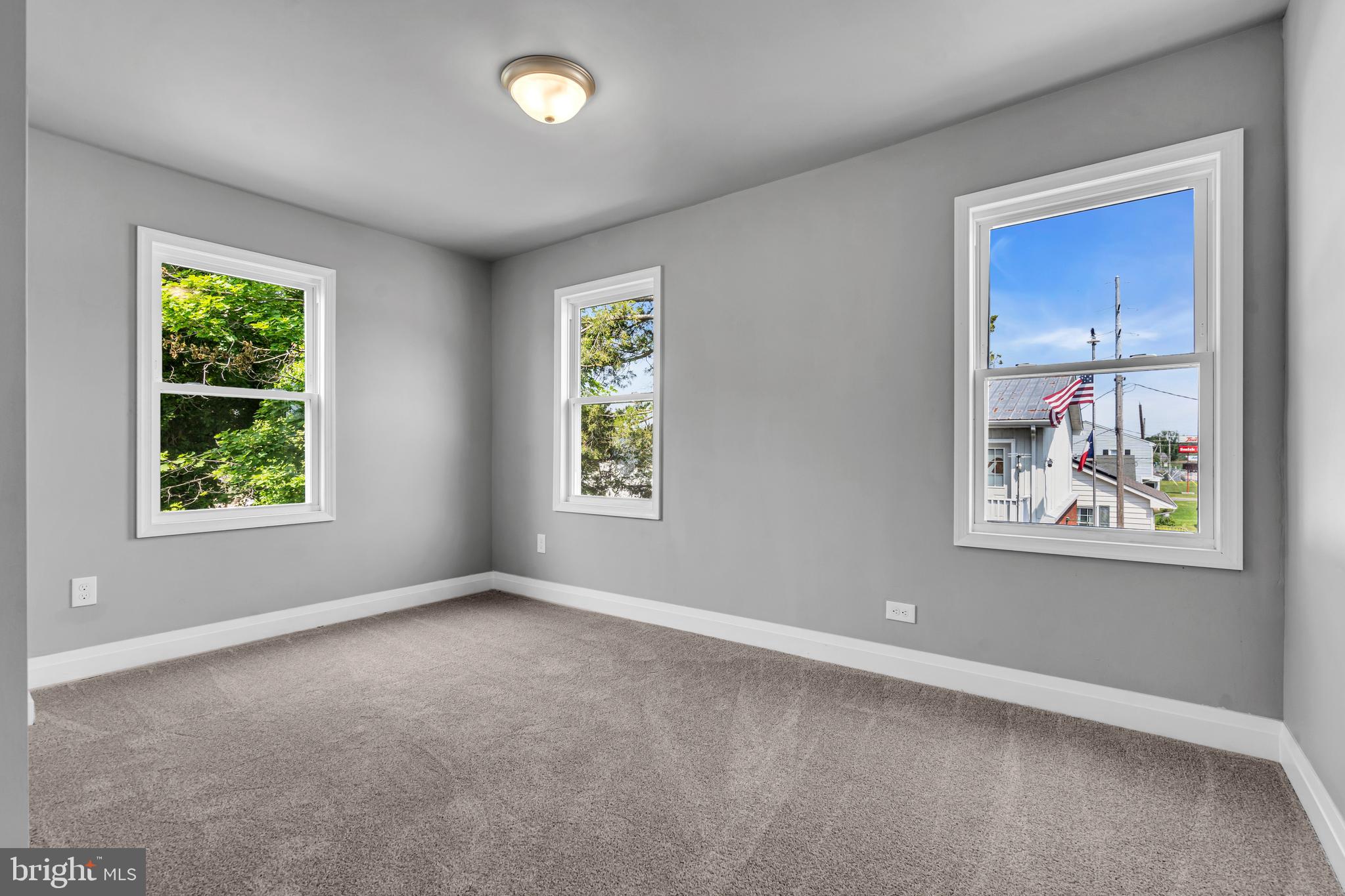 19 East Main Street Salem, NJ 08079 - Photo 19 of 28 an empty room with windows and closet