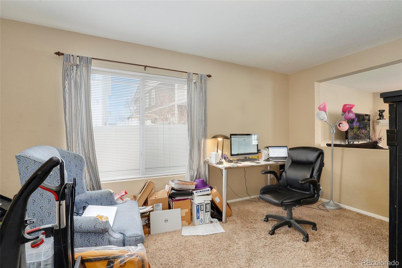 5380 Liverpool Street Denver, CO 80249 - Photo 14 of 30 a workspace with furniture and a window