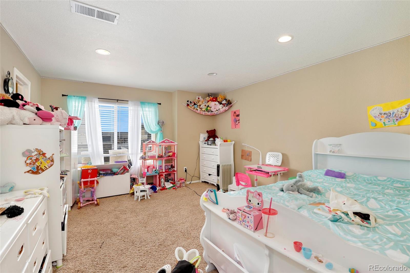 5380 Liverpool Street Denver, CO 80249 - Photo 23 of 30 a living room with baby toys