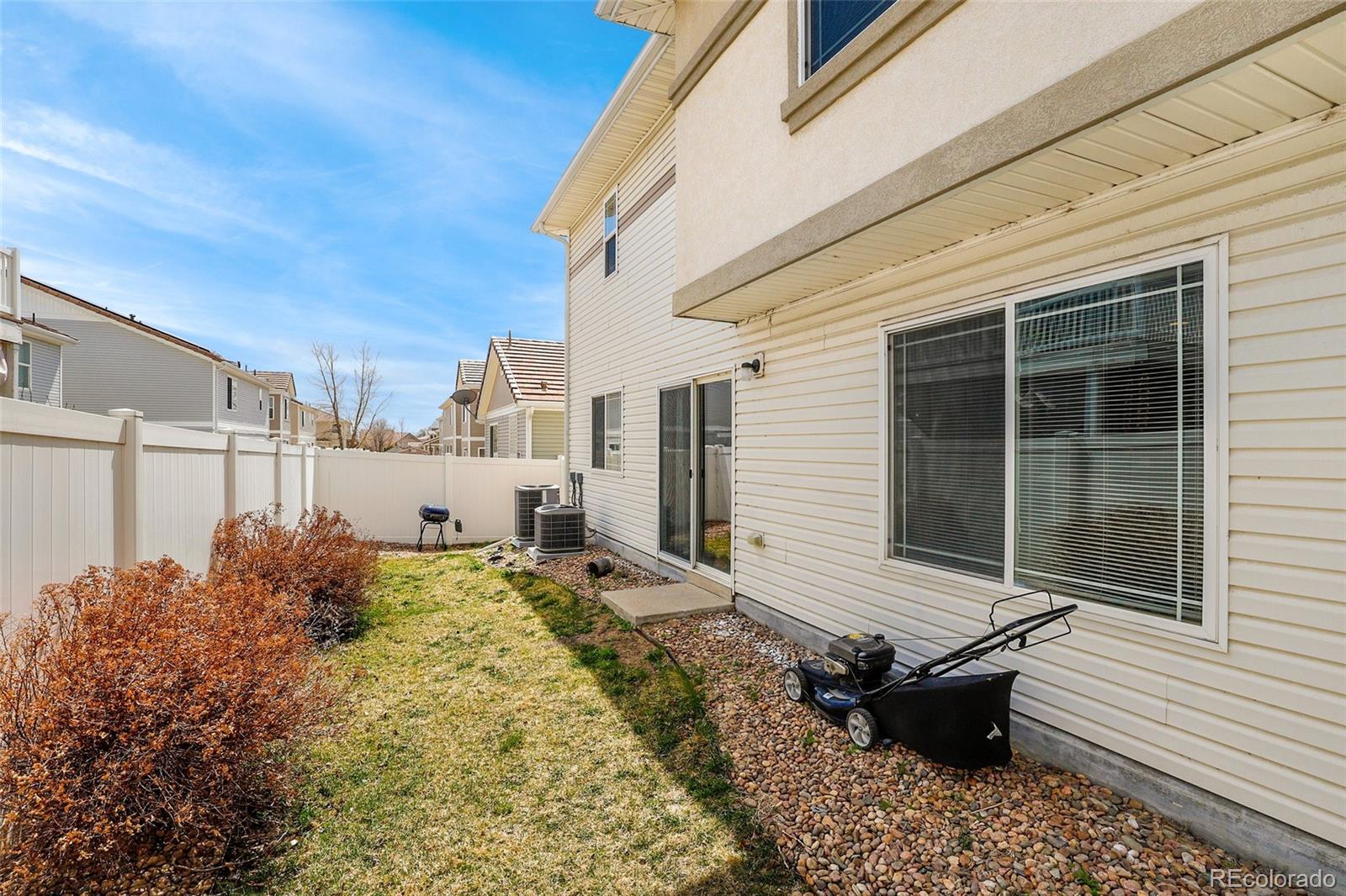 5380 Liverpool Street Denver, CO 80249 - Photo 26 of 30 a backyard of a house with table and chairs