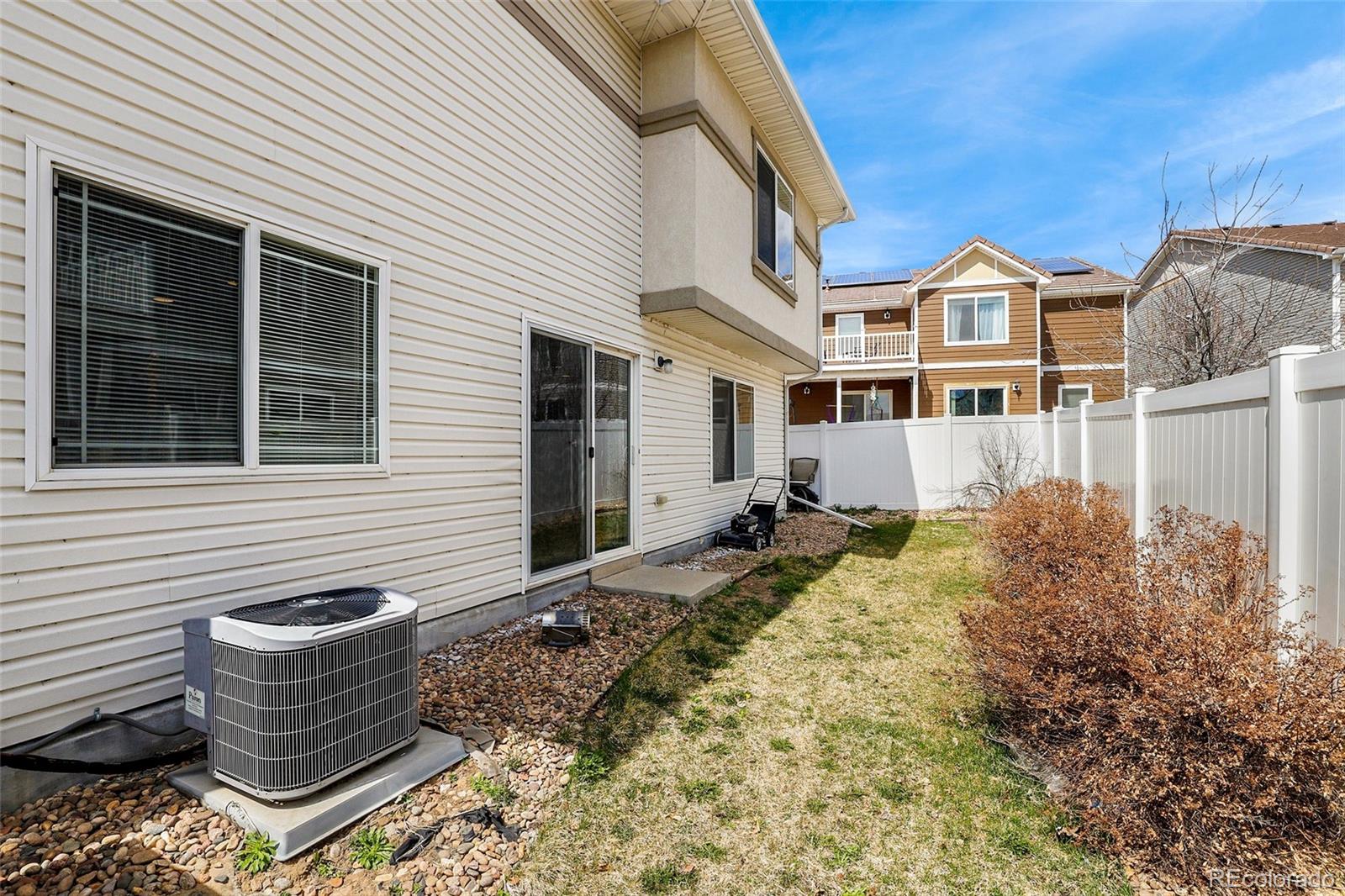 5380 Liverpool Street Denver, CO 80249 - Photo 27 of 30 a front view of a house with a yard