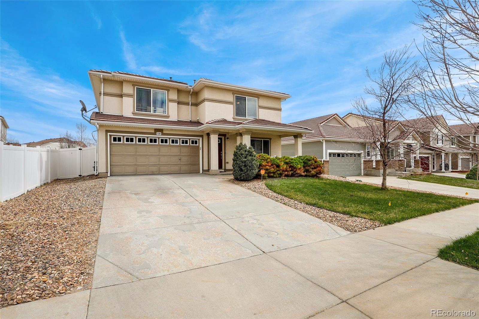 5380 Liverpool Street Denver, CO 80249 - Photo 28 of 30 a front view of a house with a yard