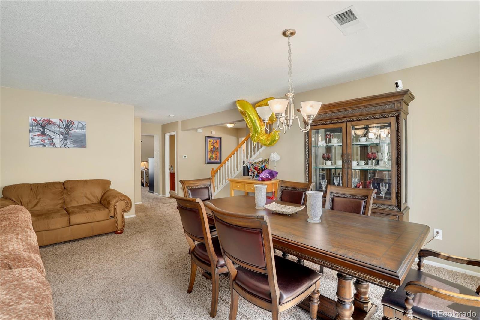 5380 Liverpool Street Denver, CO 80249 - Photo 5 of 30 a view of a dining room with furniture window and outside view