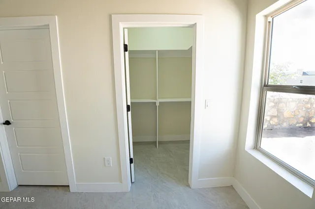 a view of an empty room and window