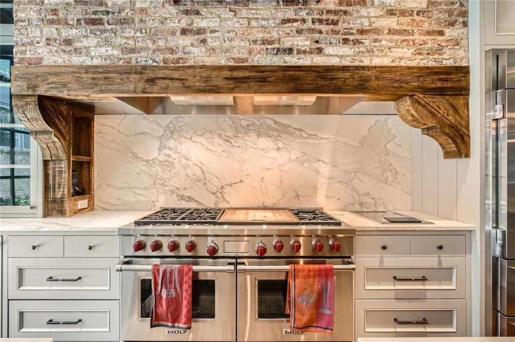 2440 Peachtree Road Northwest, Unit 9 Atlanta, GA 30305 - Photo 12 of 48 a close view of a stove top oven