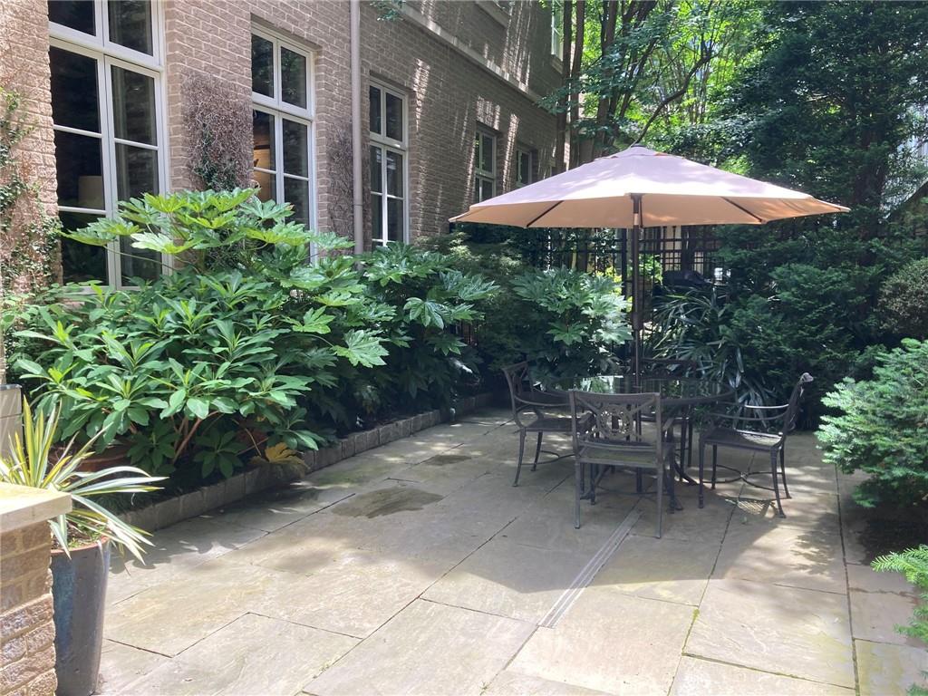 2440 Peachtree Road Northwest, Unit 9 Atlanta, GA 30305 - Photo 17 of 48 a garden view with a seating space