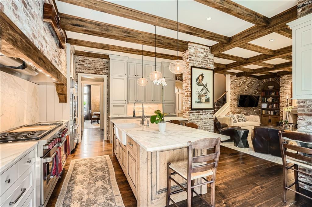 2440 Peachtree Road Northwest, Unit 9 Atlanta, GA 30305 - Photo 19 of 48 a large kitchen with a table and chairs