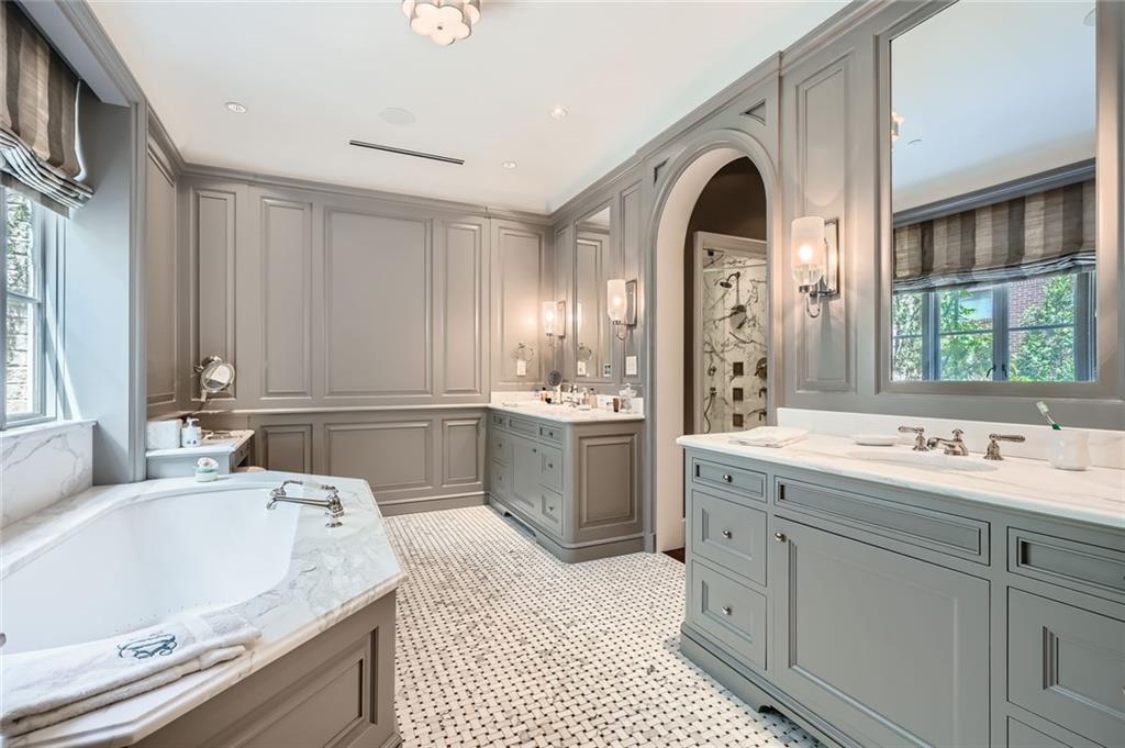 2440 Peachtree Road Northwest, Unit 9 Atlanta, GA 30305 - Photo 26 of 48 a spacious bathroom with a double vanity sink mirror and bathtub