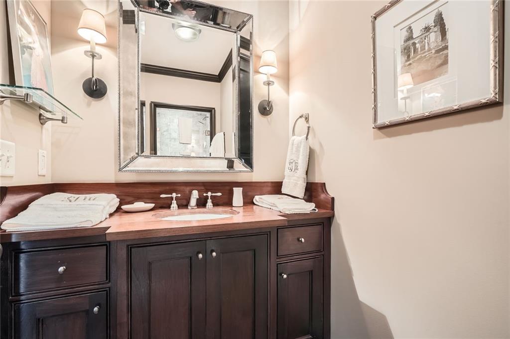 2440 Peachtree Road Northwest, Unit 9 Atlanta, GA 30305 - Photo 32 of 48 a bathroom with a sink and a mirror